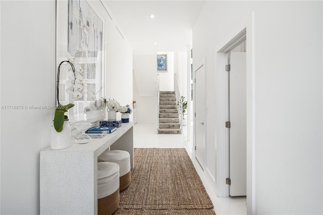 hall with light tile patterned flooring