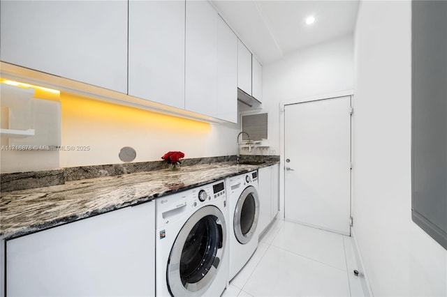 laundry area featuring independent washer and dryer and light tile patterned floors