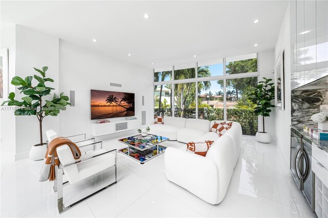 living room featuring floor to ceiling windows