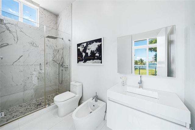 bathroom featuring vanity, toilet, an enclosed shower, and a bidet