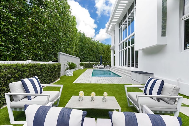 view of swimming pool featuring a lawn