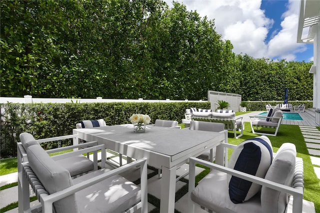 view of patio featuring a fenced in pool