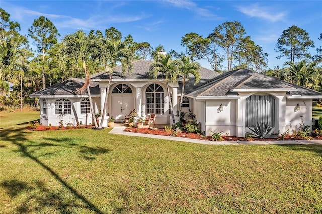 ranch-style home featuring a front lawn