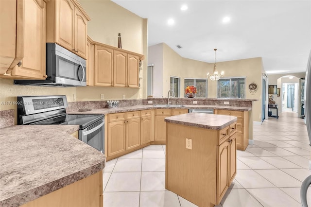 kitchen with light brown cabinets, sink, light tile patterned floors, appliances with stainless steel finishes, and a kitchen island