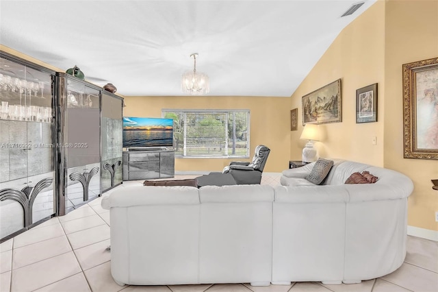 tiled living room featuring a notable chandelier and vaulted ceiling