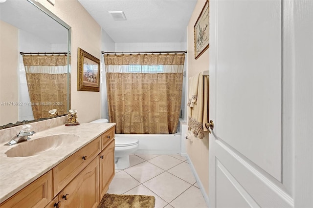 full bathroom featuring vanity, shower / bath combination with curtain, tile patterned flooring, toilet, and a textured ceiling