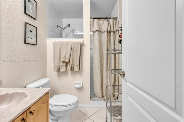 bathroom featuring curtained shower, tile patterned flooring, a textured ceiling, toilet, and vanity