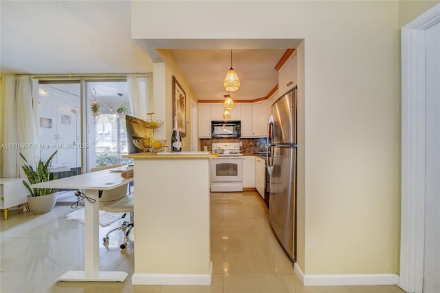 kitchen with white electric range, stainless steel refrigerator, decorative light fixtures, white cabinetry, and a breakfast bar area