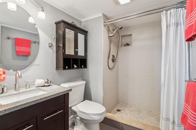 bathroom featuring toilet, crown molding, vanity, and a shower with curtain