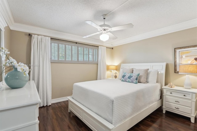 bedroom with ceiling fan, dark hardwood / wood-style flooring, ornamental molding, and a textured ceiling