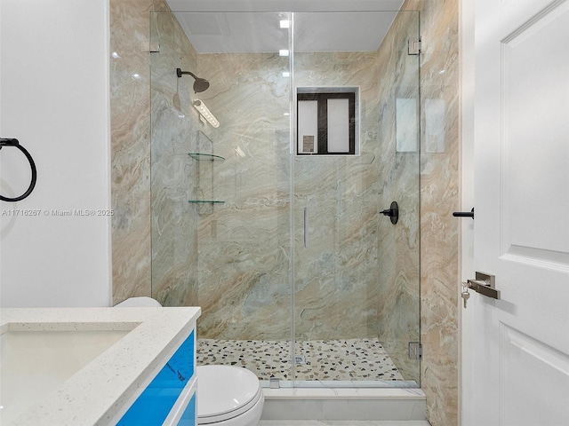 bathroom with walk in shower, vanity, and toilet