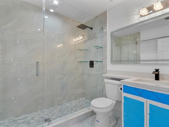 bathroom with vanity, an enclosed shower, and toilet