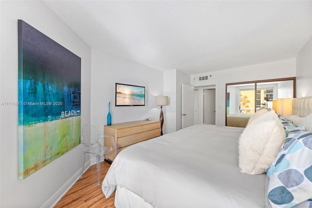 bedroom with light wood-type flooring