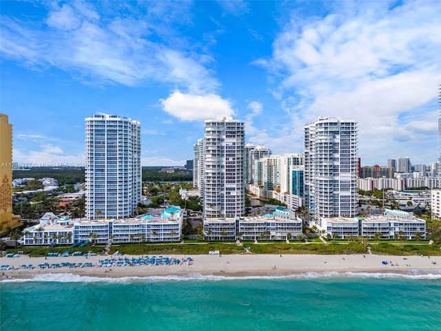 exterior space with a water view and a view of the beach