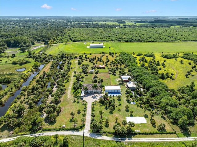 birds eye view of property with a rural view