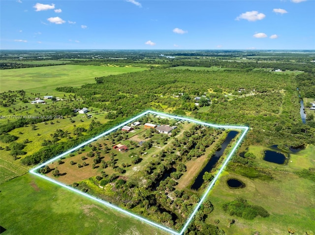 birds eye view of property with a rural view