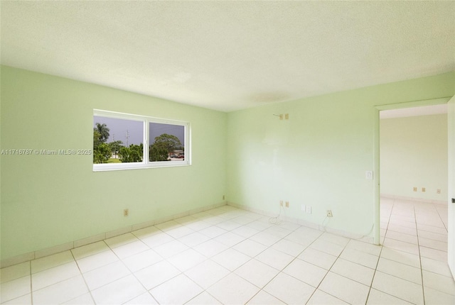 spare room featuring a textured ceiling