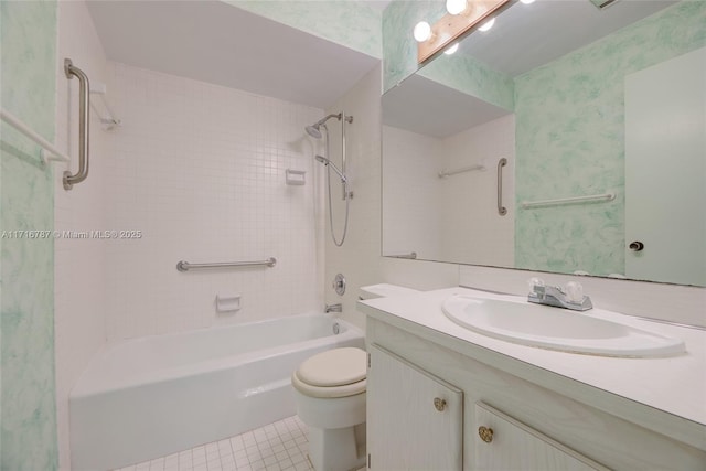 full bathroom featuring tiled shower / bath, tile patterned flooring, vanity, and toilet