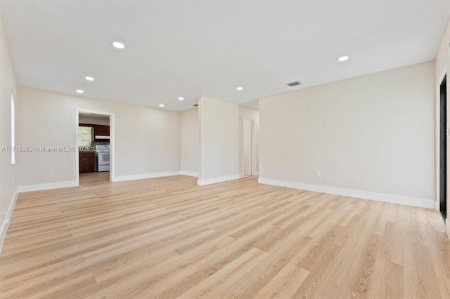 spare room featuring light hardwood / wood-style flooring