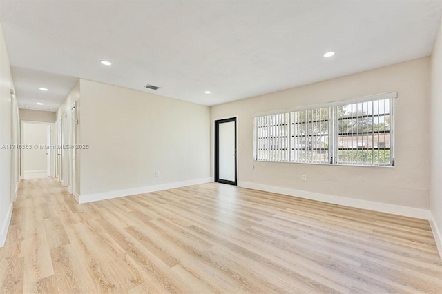 empty room with light wood-type flooring