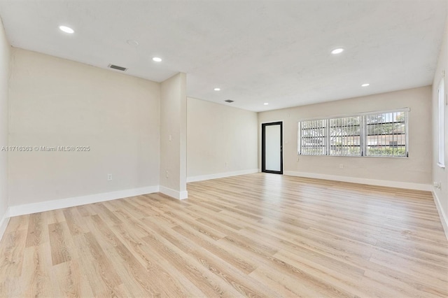 unfurnished room featuring light hardwood / wood-style flooring