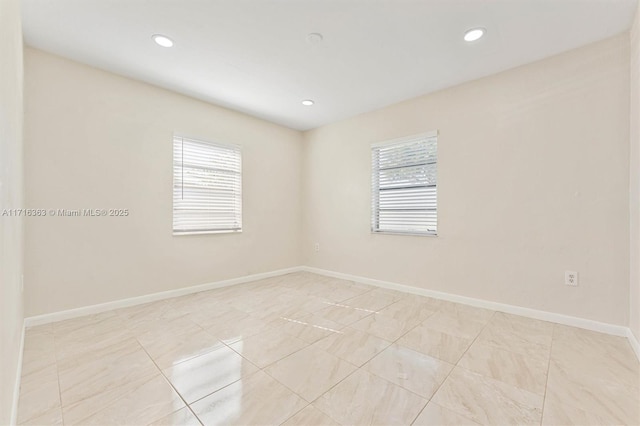 tiled empty room with a healthy amount of sunlight