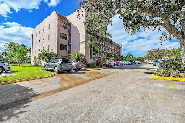2606 NW 104th Ave Unit 202, Sunrise, FL 33322 - view of apartment building / complex featuring uncovered parking