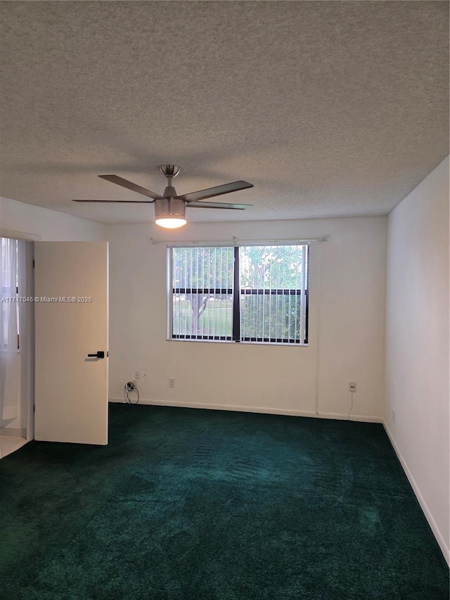 2606 NW 104th Ave Unit 202, Sunrise, FL 33322 - spare room with dark colored carpet, ceiling fan, and a textured ceiling