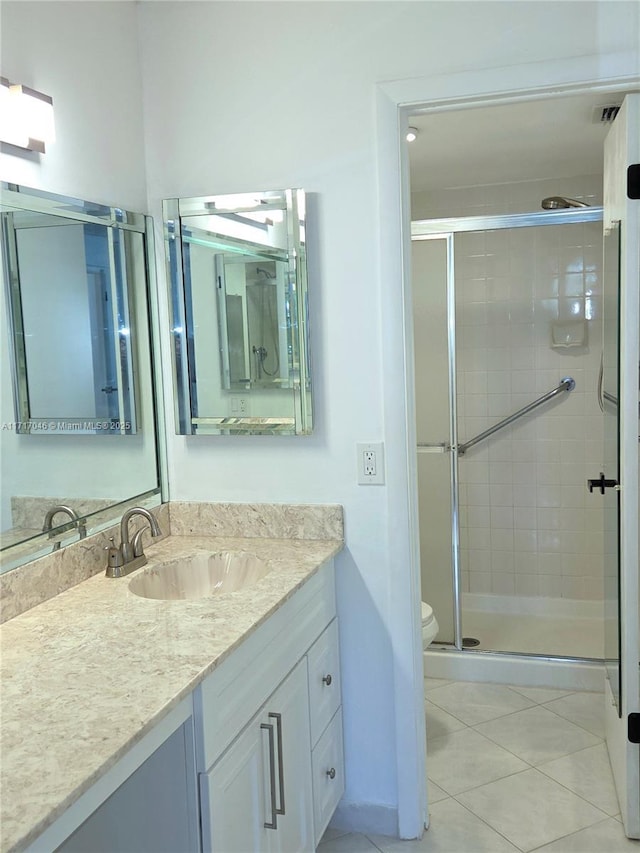 2606 NW 104th Ave Unit 202, Sunrise, FL 33322 - full bathroom featuring a stall shower, vanity, and tile patterned floors