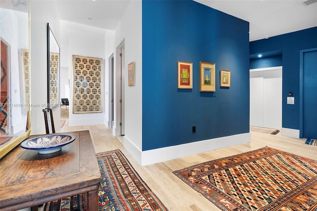 corridor featuring light hardwood / wood-style floors