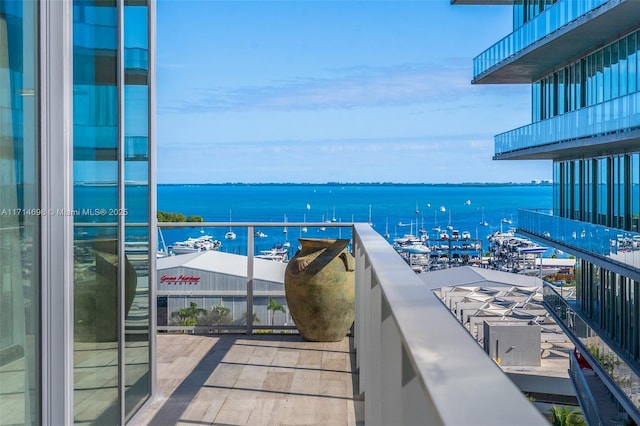 balcony featuring a water view