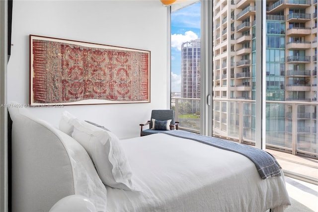 bedroom with floor to ceiling windows