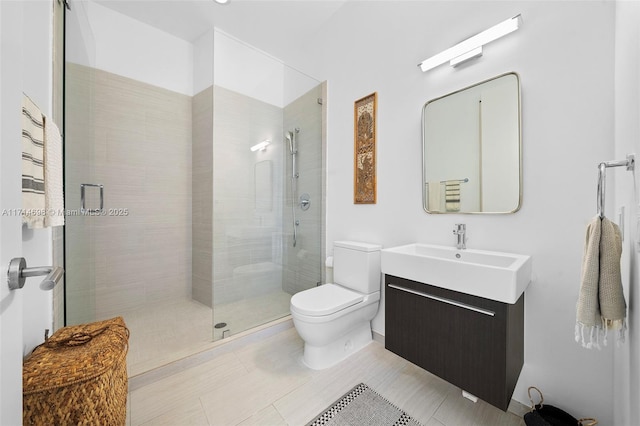 bathroom featuring vanity, tile patterned floors, toilet, and walk in shower