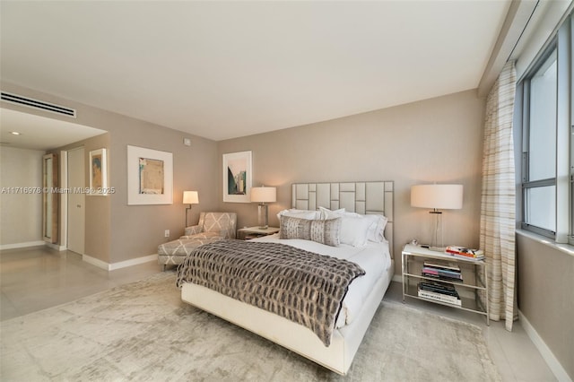 bedroom with visible vents and baseboards