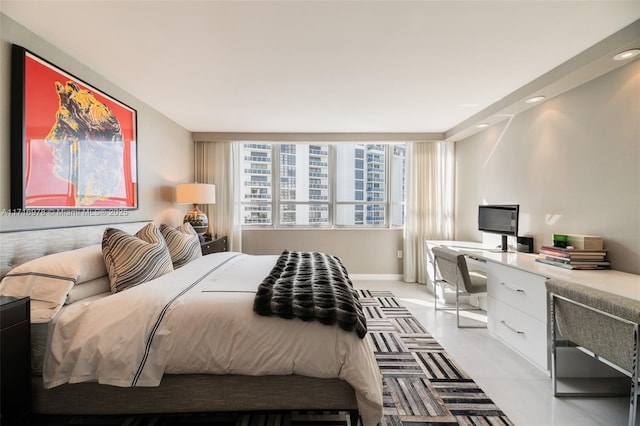 bedroom featuring built in study area and baseboards