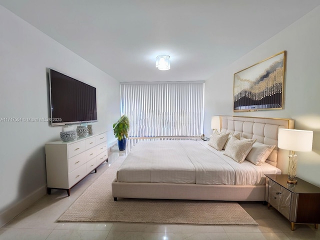 bedroom featuring light tile patterned flooring