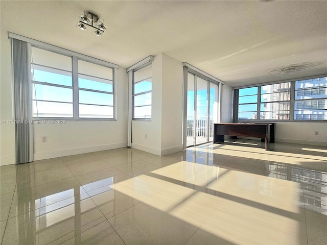 18051 Biscayne Blvd Unit 1204, Aventura, FL 33160 - spare room with tile patterned flooring and baseboards