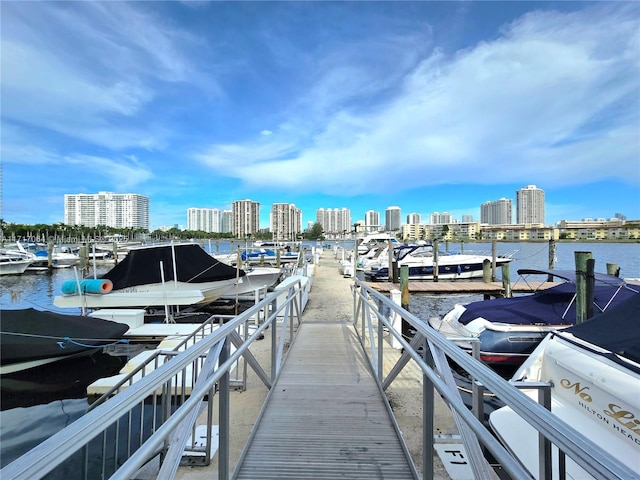 dock area with a water view and a city view