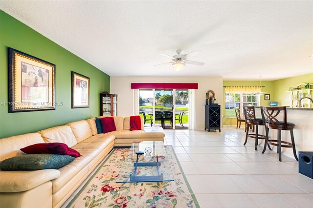 2355 NW 137th Ter, Sunrise, FL 33323 - living area featuring light tile patterned floors and ceiling fan