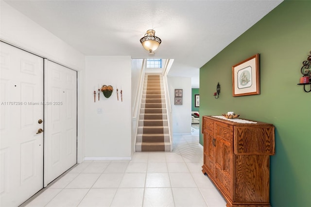 foyer entrance featuring a textured ceiling