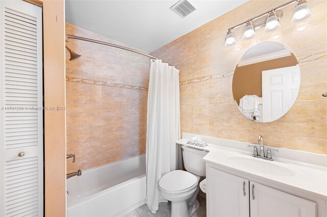 2355 NW 137th Ter, Sunrise, FL 33323 - full bath with tile walls, shower / tub combo, a closet, toilet, and vanity