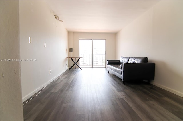 sitting room with dark hardwood / wood-style floors