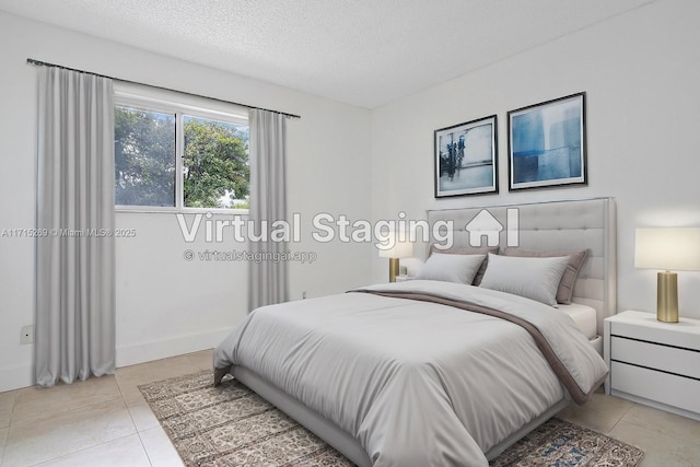 tiled bedroom featuring a textured ceiling