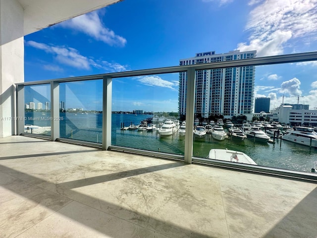 balcony with a water view and a city view