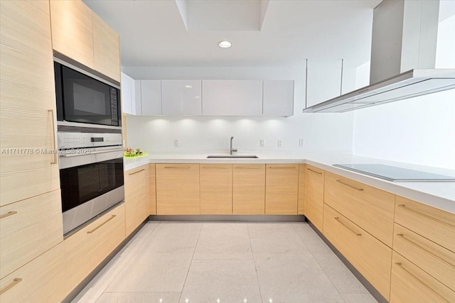 17301 Biscayne Blvd Unit 305, North Miami Beach, FL 33160 - kitchen featuring oven, light brown cabinetry, built in microwave, a sink, and black electric cooktop