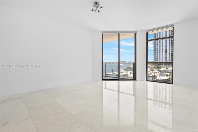 17301 Biscayne Blvd Unit 305, North Miami Beach, FL 33160 - spare room featuring expansive windows and a city view