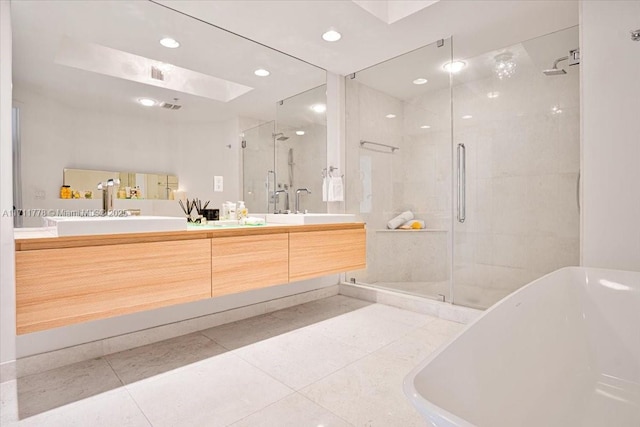 17301 Biscayne Blvd Unit 305, North Miami Beach, FL 33160 - full bath with a shower stall, a freestanding tub, double vanity, tile patterned flooring, and recessed lighting