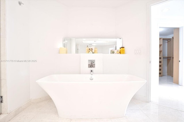 17301 Biscayne Blvd Unit 305, North Miami Beach, FL 33160 - full bathroom featuring a freestanding bath, baseboards, and tile patterned floors