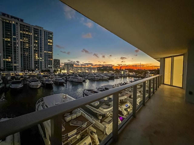 balcony with a water view and a city view