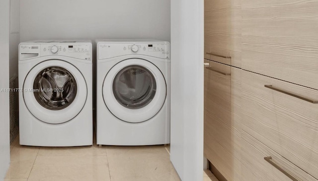 17301 Biscayne Blvd Unit 305, North Miami Beach, FL 33160 - laundry area featuring washing machine and dryer and light tile patterned floors